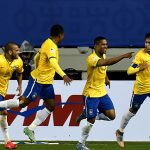 Brazil's midfielder Douglas Costa (2-R) celebrates with teammates after scoring against Peru during their 2015 Copa America football championship match in Temuco, Chile, on June 14, 2015. Brazil won 2-1.    AFP PHOTO / NELSON ALMEIDA        (Photo credit should read NELSON ALMEIDA/AFP/Getty Images)